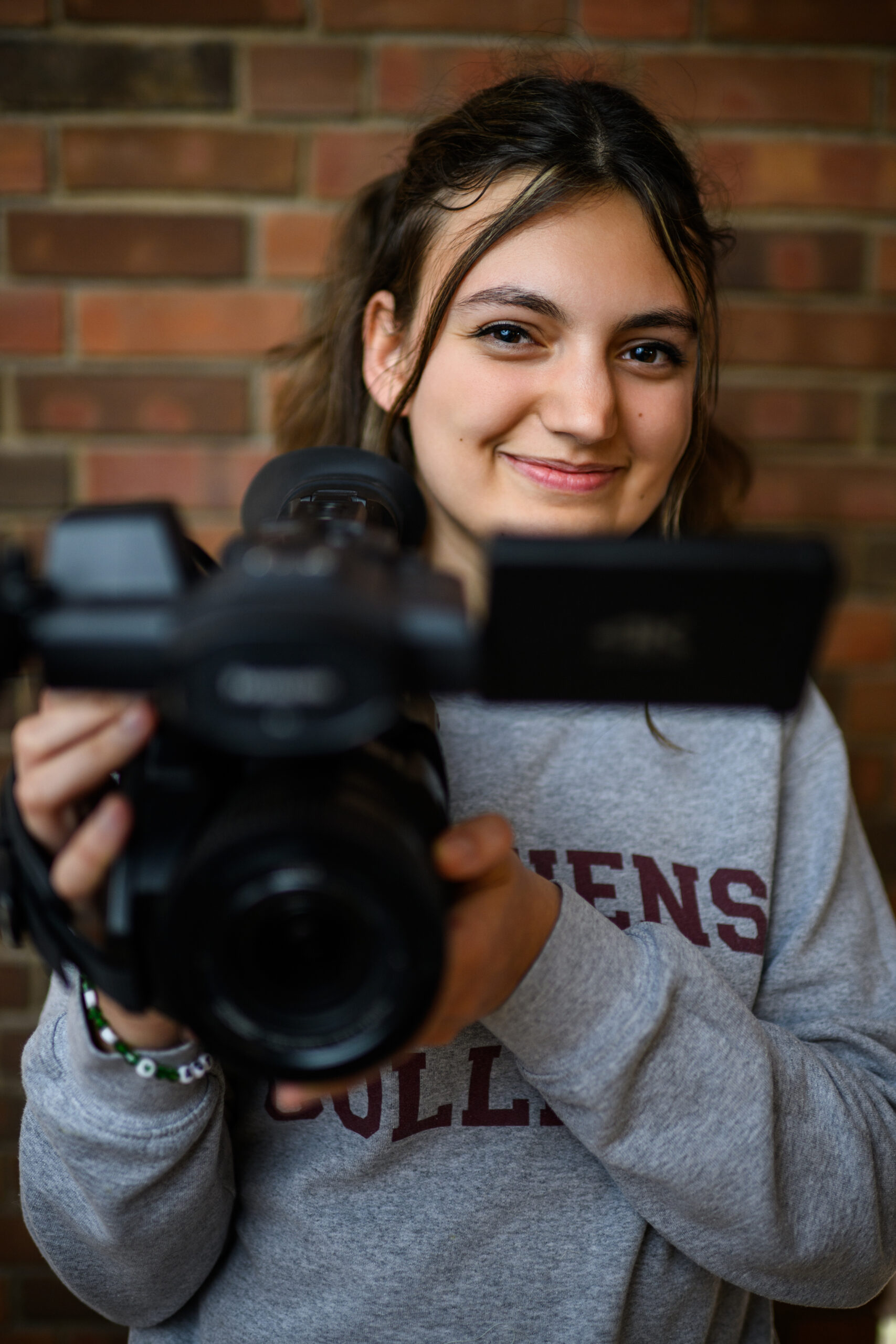 Stephens College student holds video camera