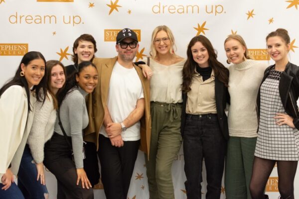 Group photo backstage at a fashion show.