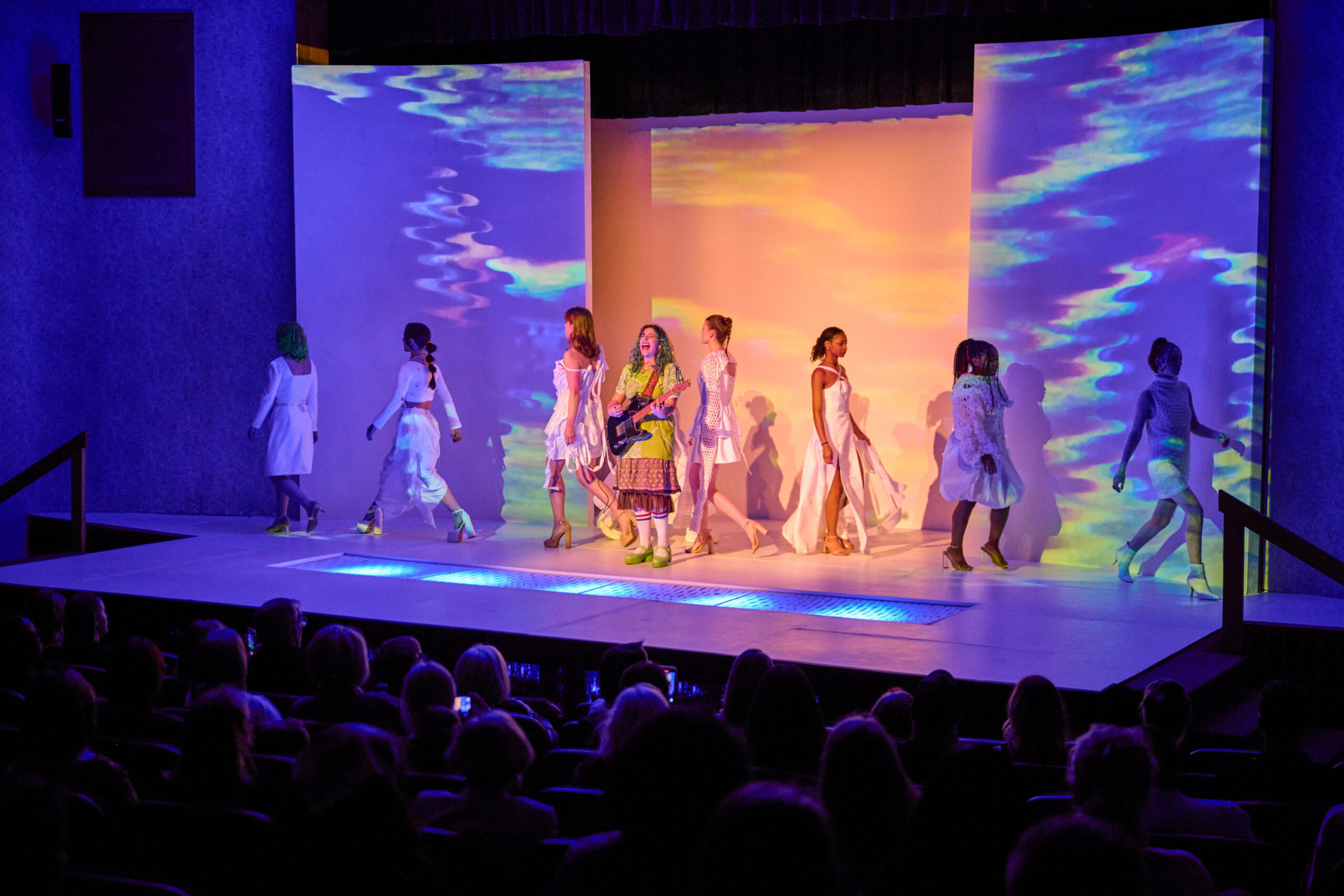 Models on stage at a student fashion show. Photo courtesy Schaefer Photography.