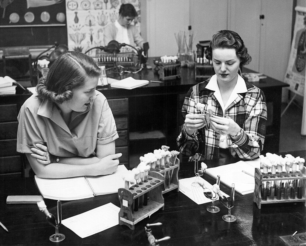 Two Stephens students in a chemistry lab. Photo is black and white and appears to have been taken in the 1950s.