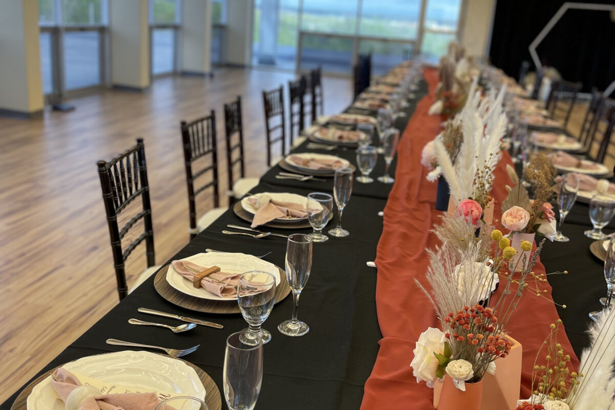 Decorated table with full place settings and centerpieces