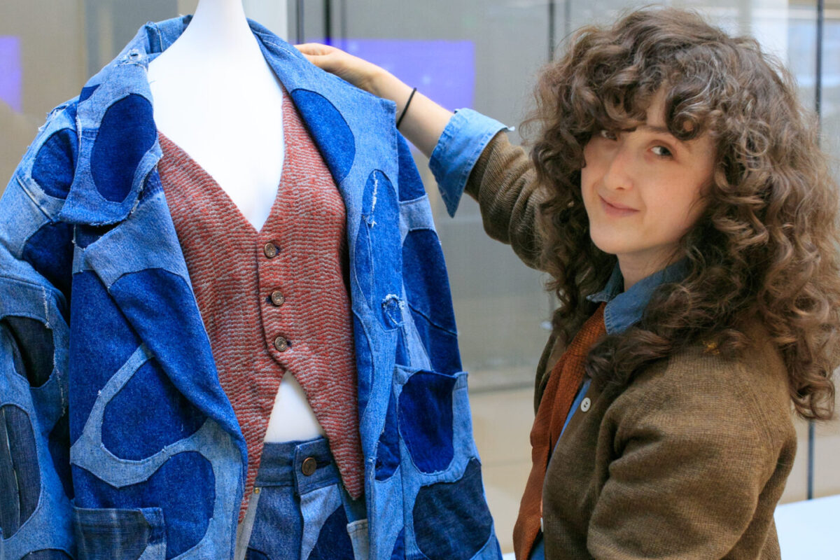 Claire Johnson '25 poses with her design.