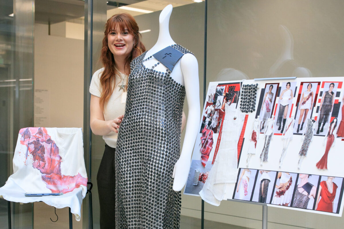 Julia League ’25 poses with her design.