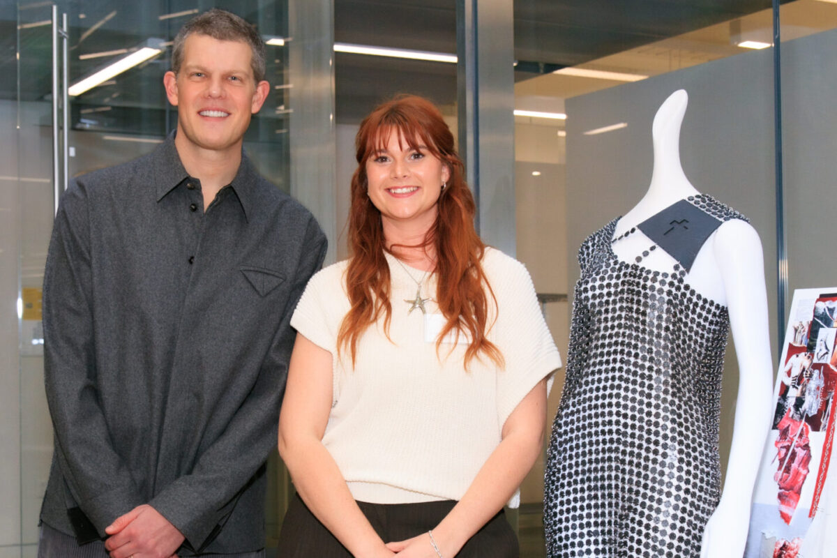 Hannah Kleman ’25 poses with her design and Wes Gordon.